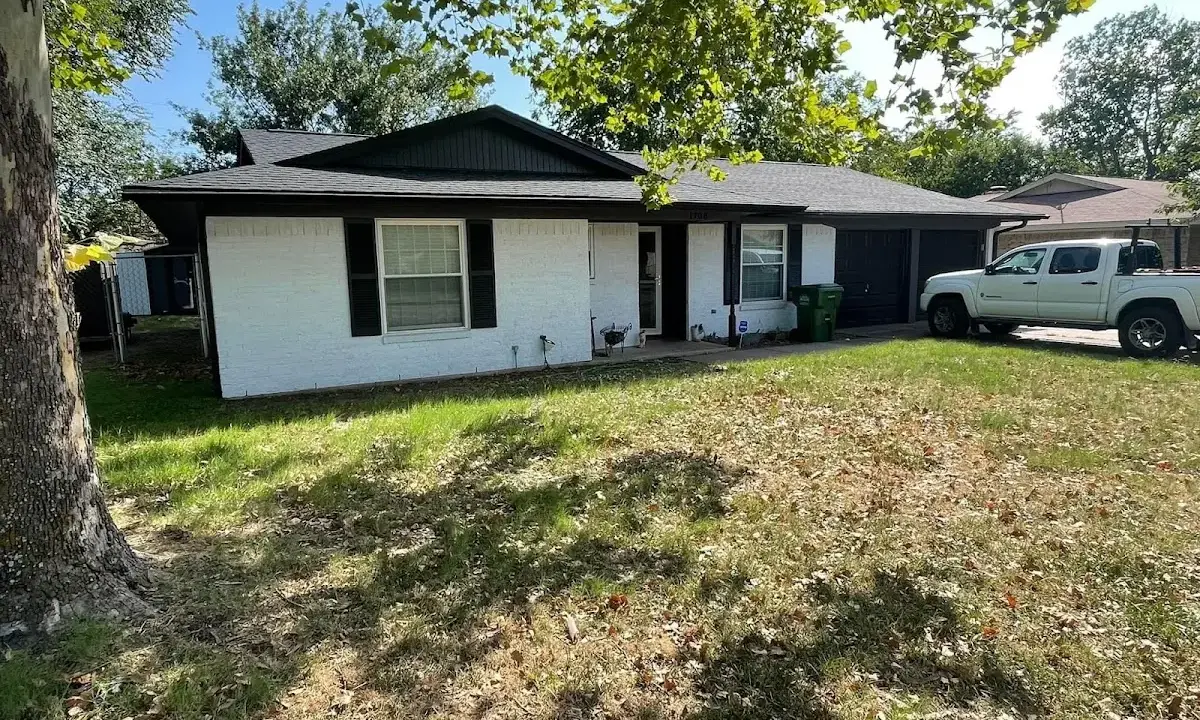 Professional roofing crew working on a residential roof in Lewisboro